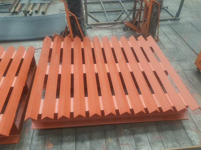Red-painted steel angle grating frame