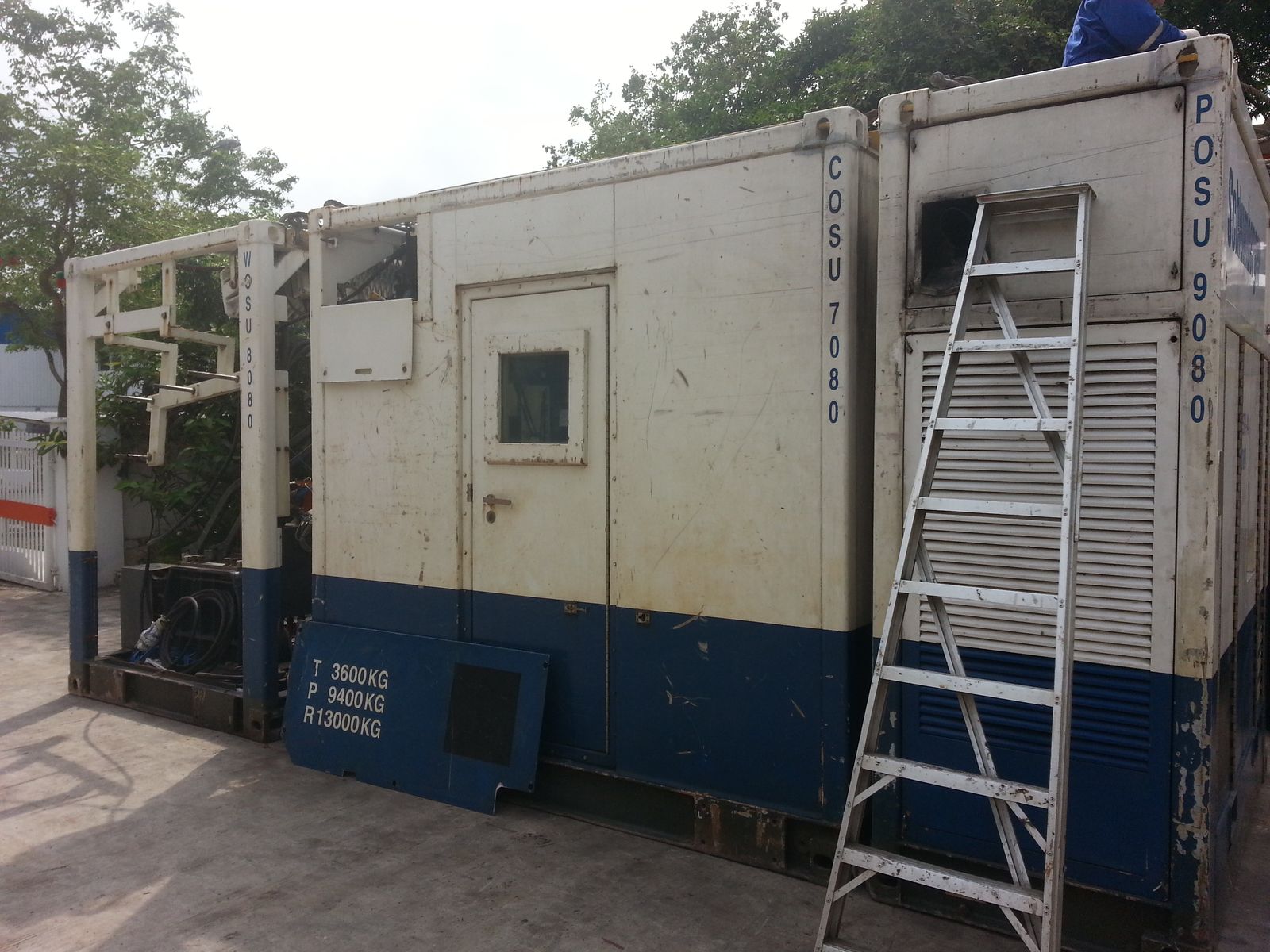 Large container-type unit with a ladder against its side