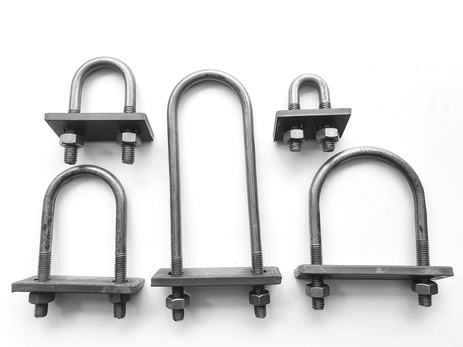 Five U-bolts of different sizes with plates and nuts